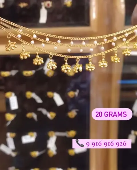Pearl drop chains and jhumka pairs on the display wall.
